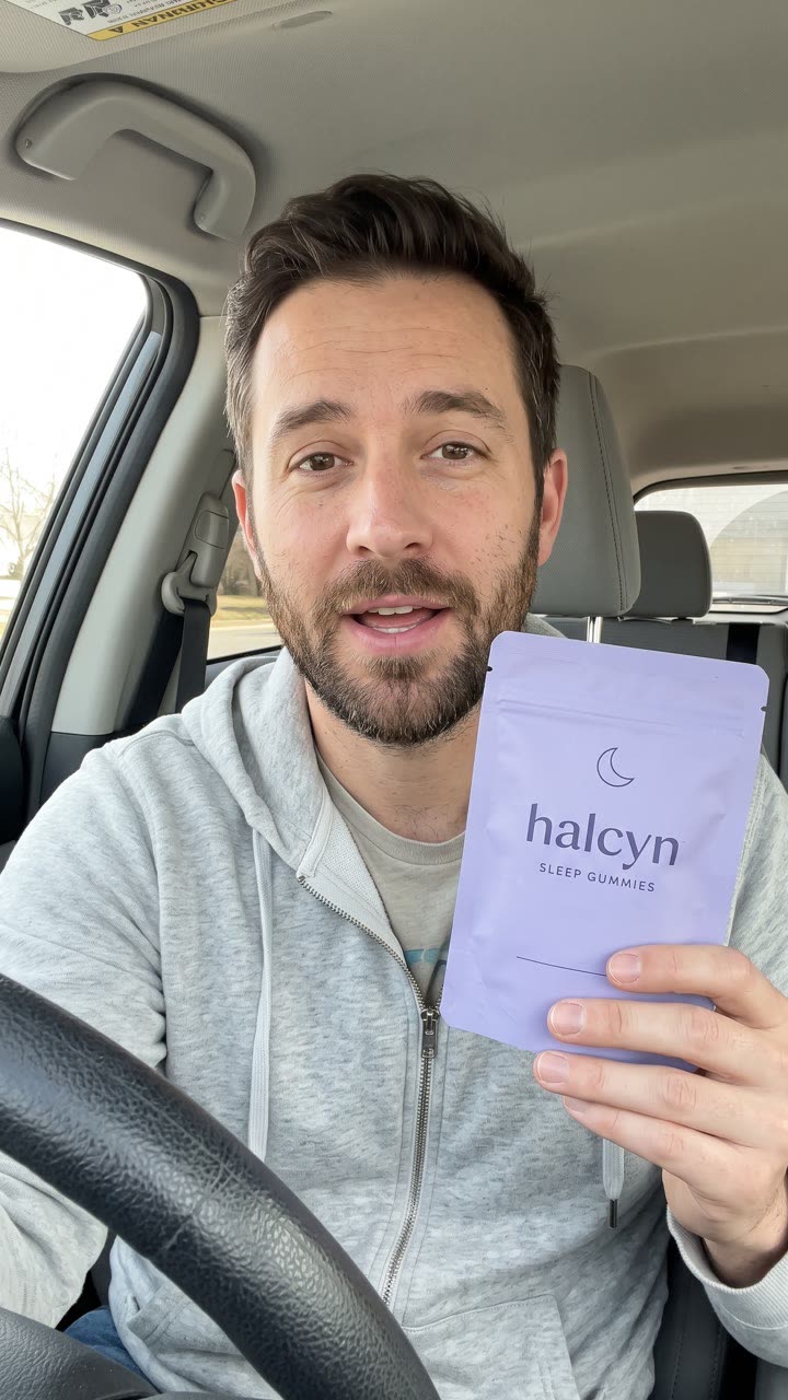 AI presenter holding the halcyn pouch in a car